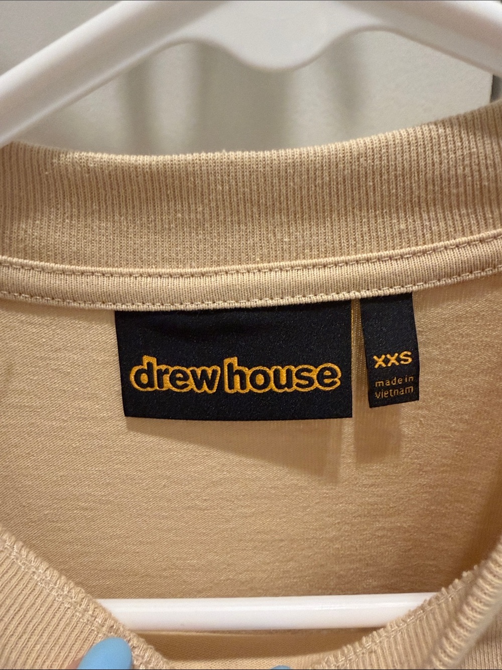 drew house beige logo tee with black tag
